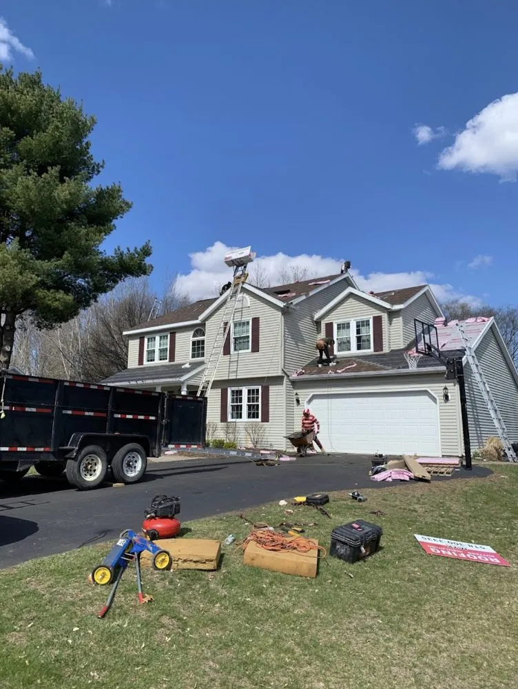 Slide of Henry’s Roofing & Siding
