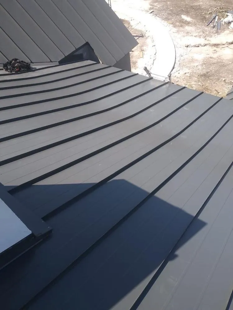 Slide of Her Construction Roofing Specialists 