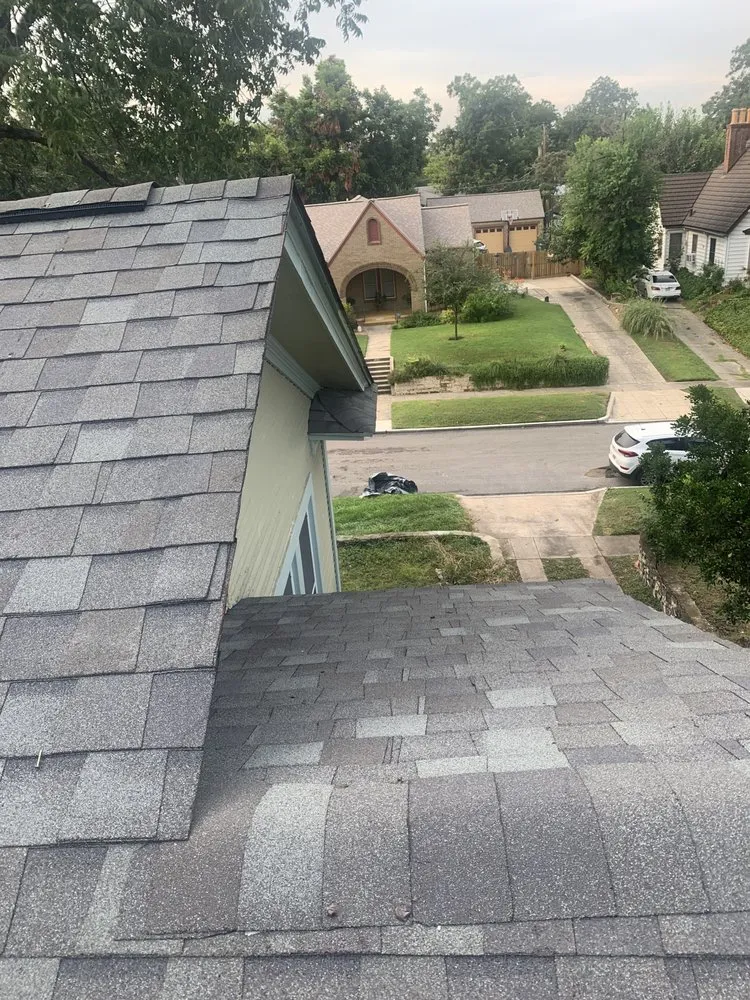 Slide of Her Construction Roofing Specialists 