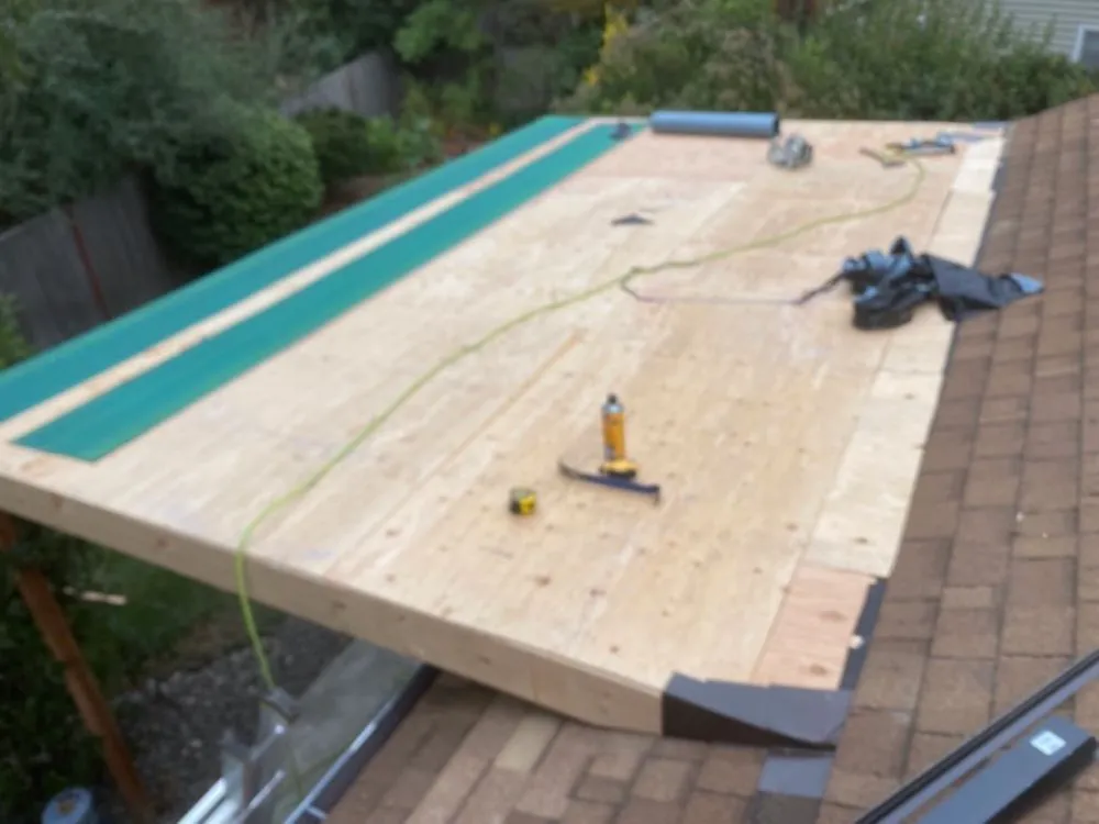 Slide of HER Roofing