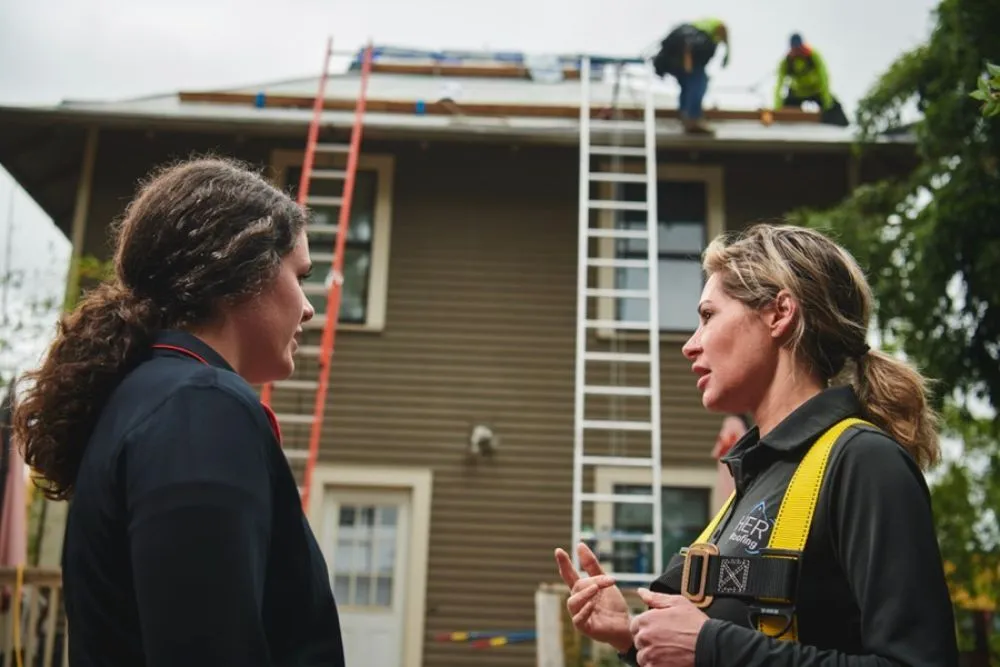 Slide of HER Roofing