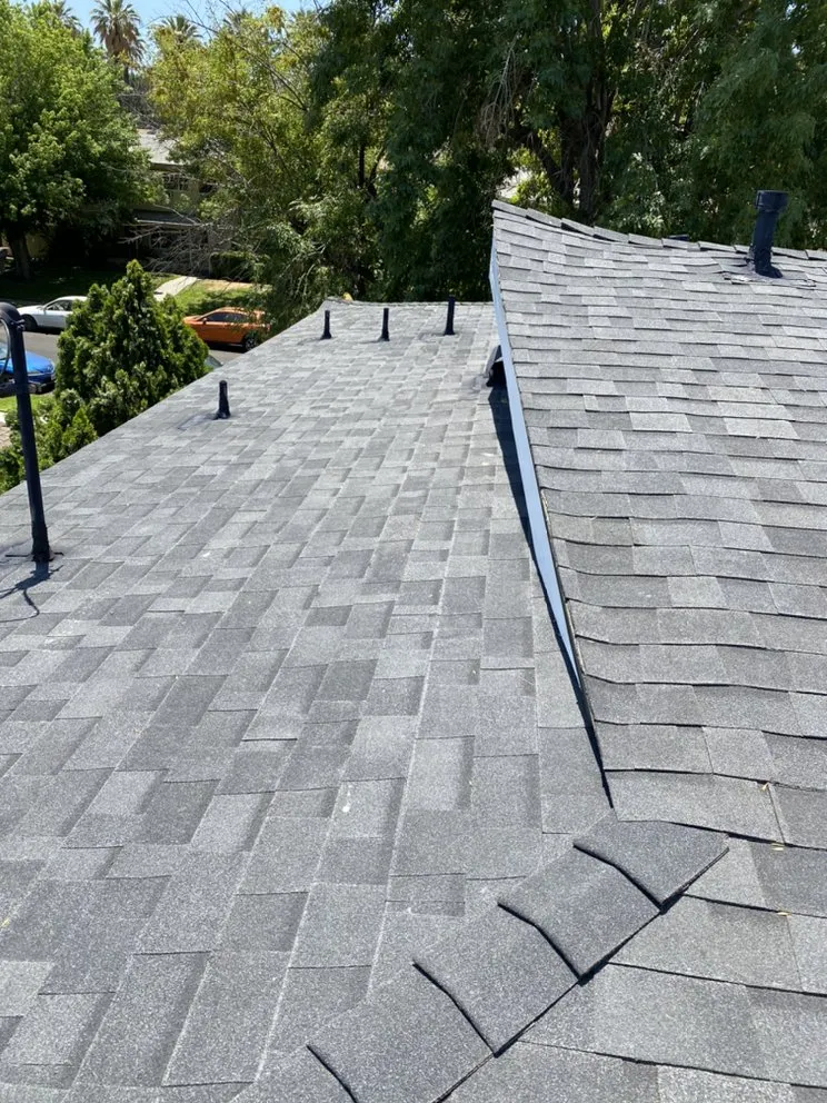 Slide of H&M ROOFING