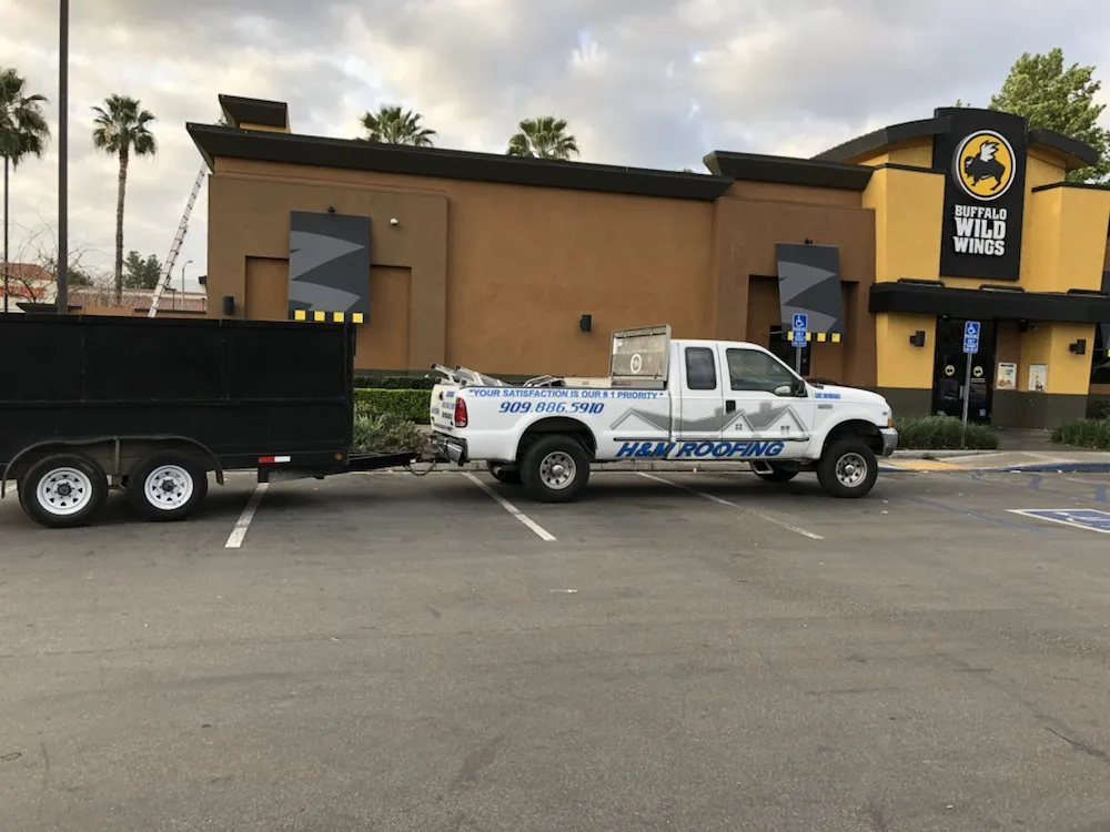 Slide of H&M ROOFING