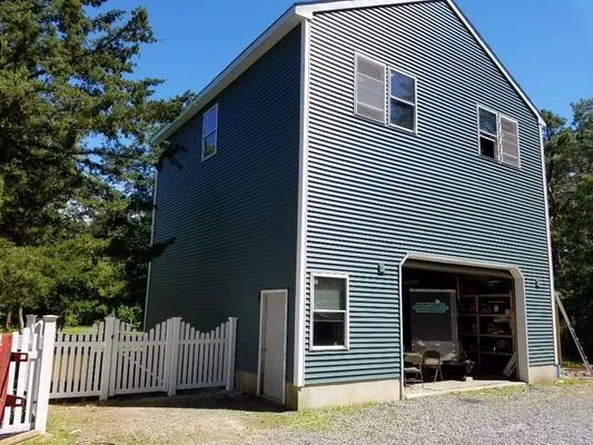 Homeland Home Improvement Logo