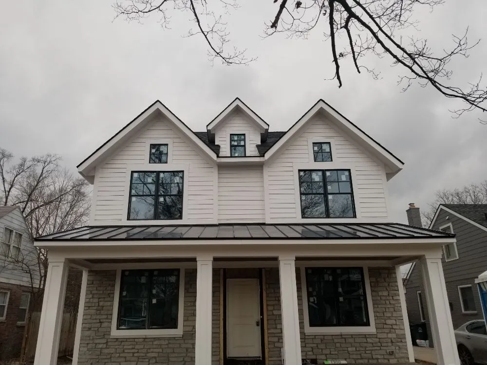 Local roof installation after storm damage in Fair Haven, MI by Hubbard Home Improvements
