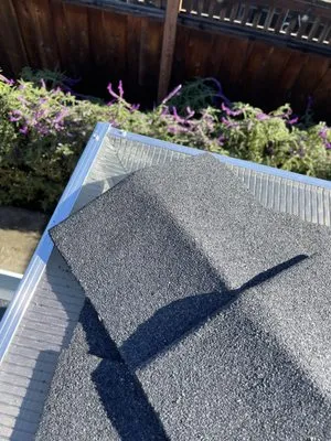 Hugos Roofing and Gutters Logo