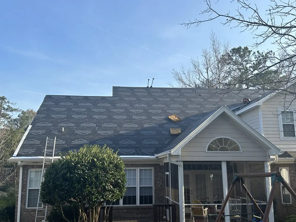 Slide of Hunt Riggs Roofing