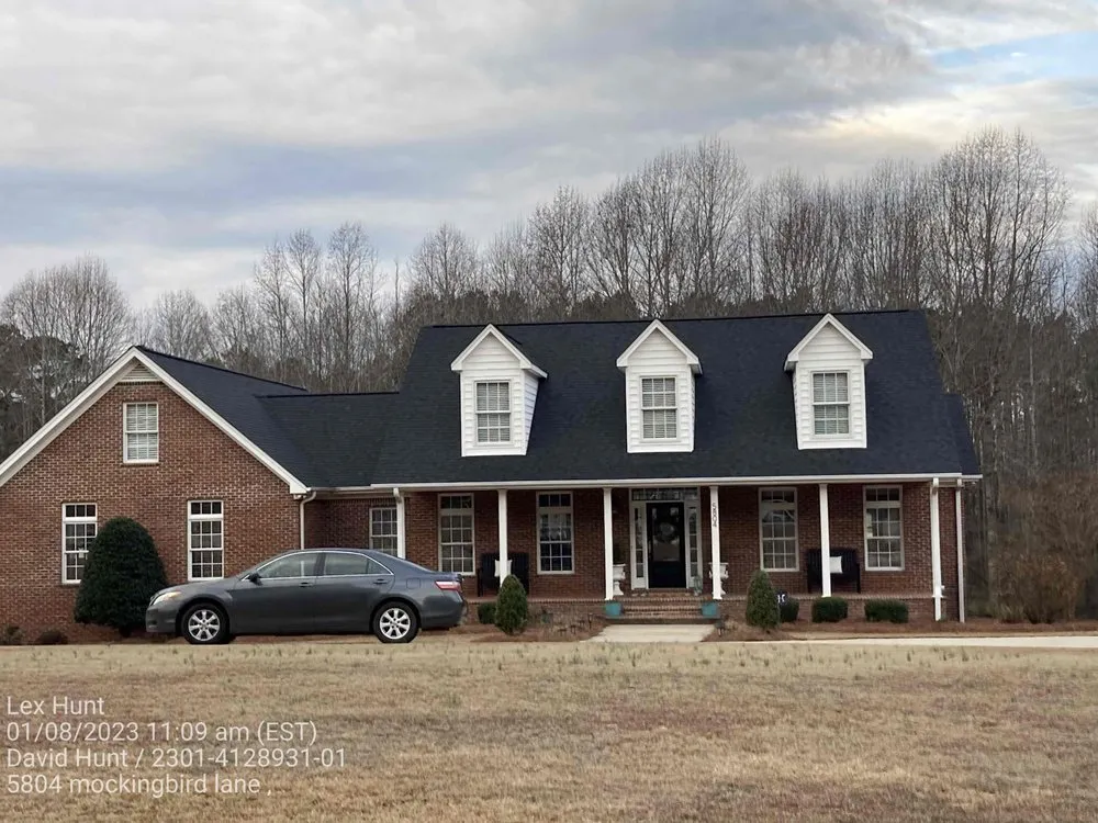 Slide of Hunt Riggs Roofing