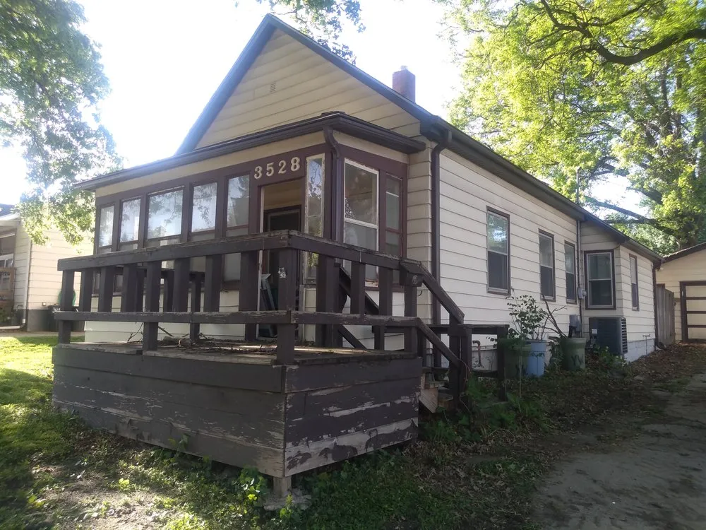 Slide of Husker Roofing Siding & Gutter