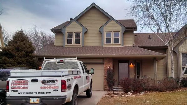 Husker Roofing Siding & Gutter Logo