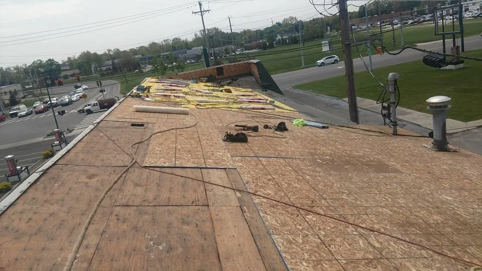 Slide of Husky Roofing