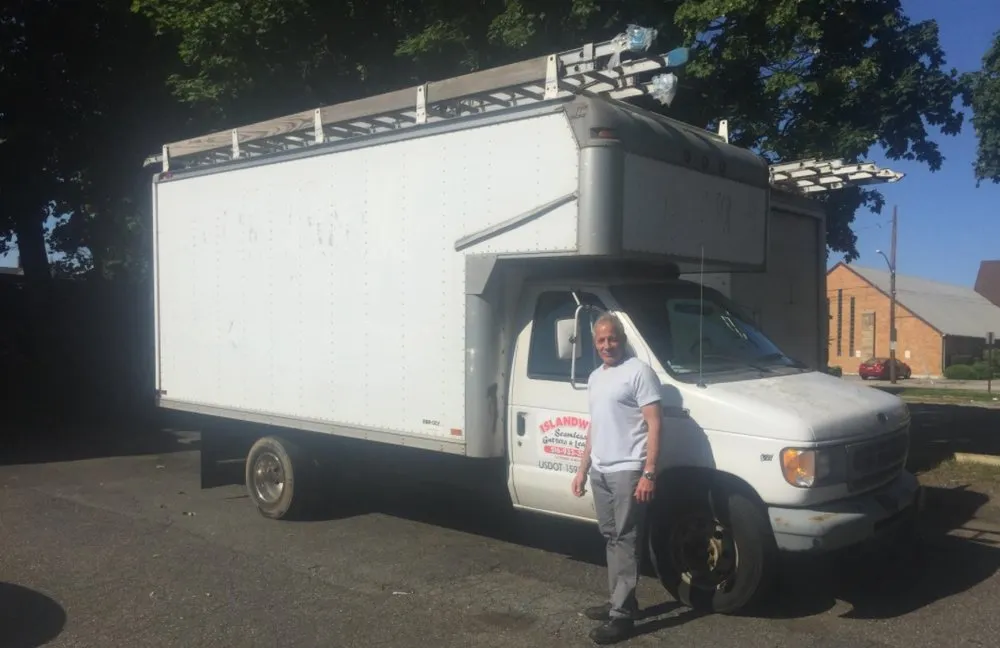 Slide of IslandWide Seamless Gutters & Leaders System