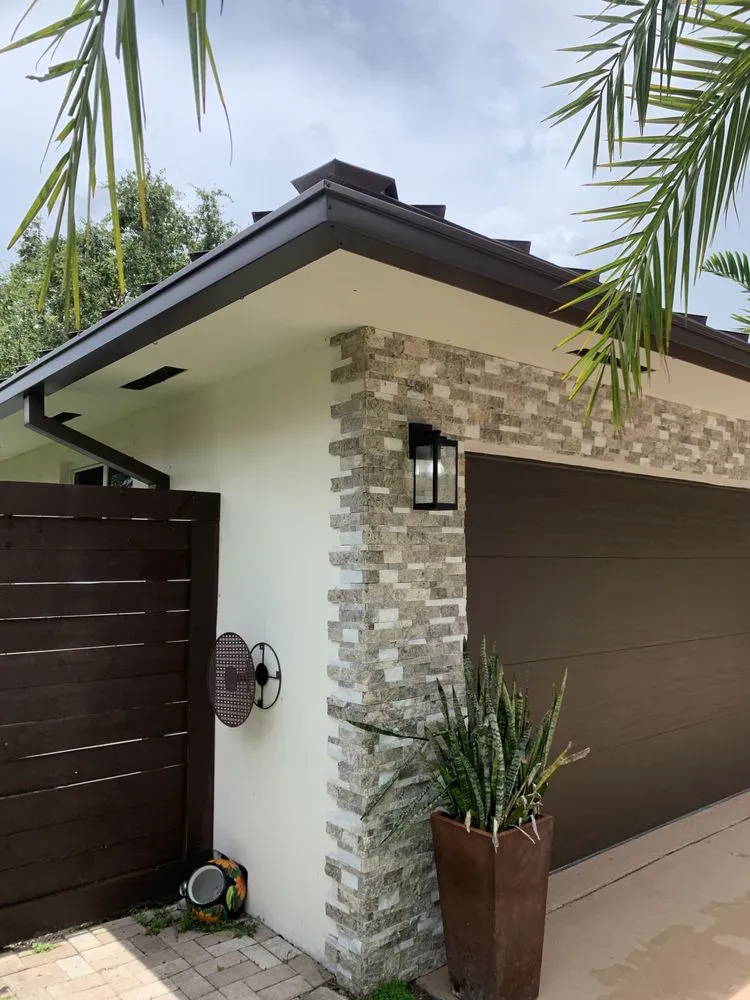 Slide of Jad Rain Gutters