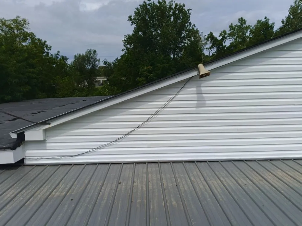 Professional flat roof repair after storm damage in Marianna, PA by James Price Construction