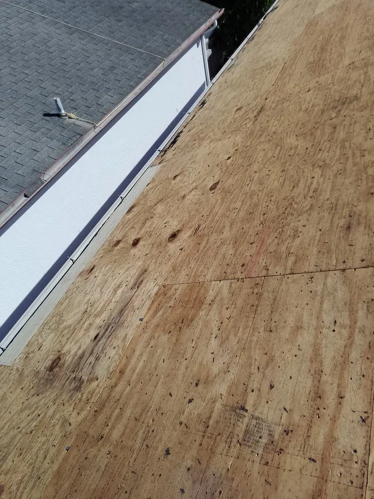 Slide of JAT Roofing