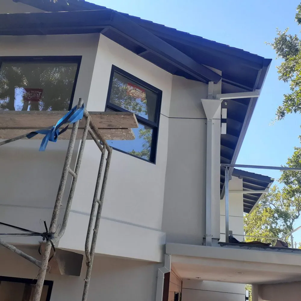 Slide of JB Rain Gutter installation