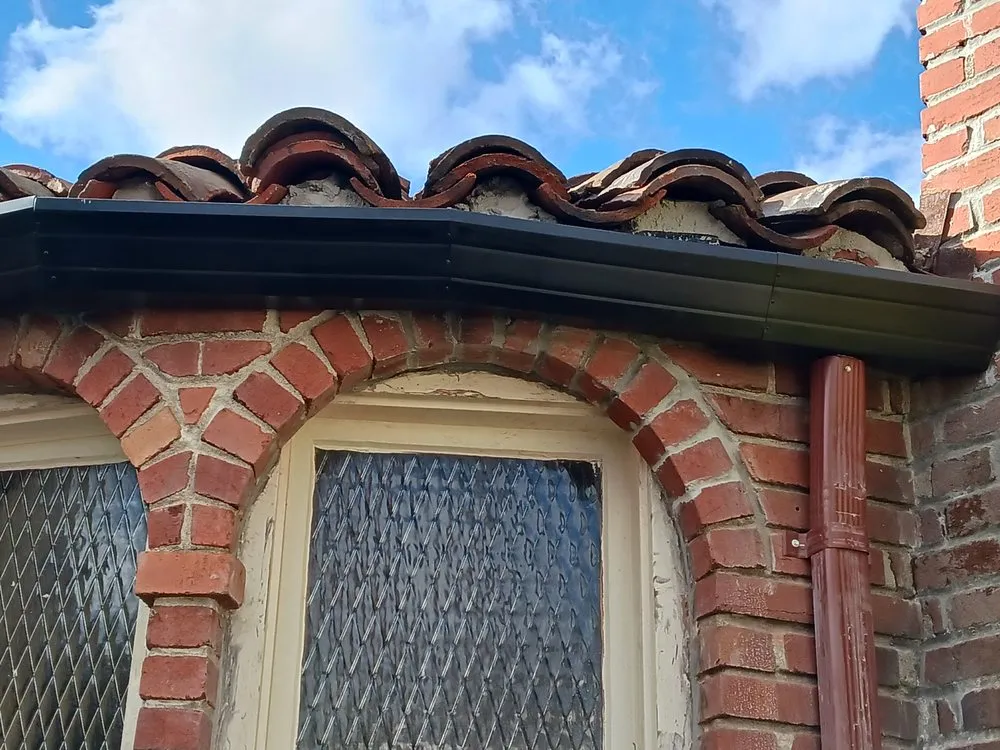 Slide of JB Rain Gutter installation