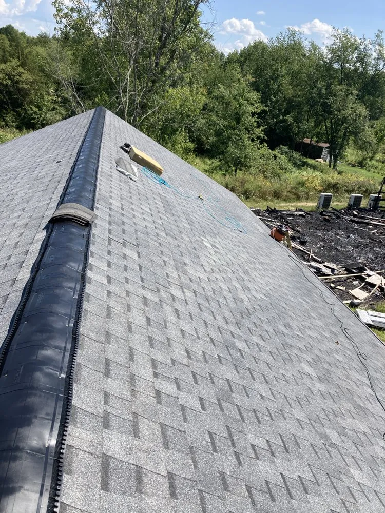 Slide of J&E Roofing & Repairs