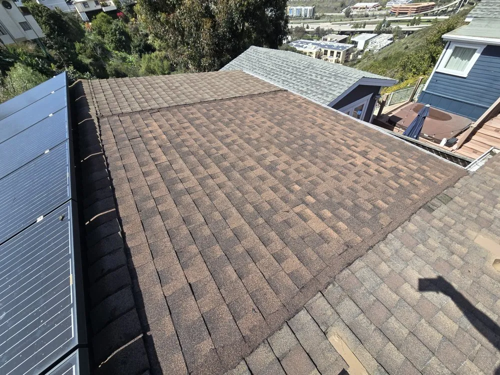 Slide of J&E Roofing Services