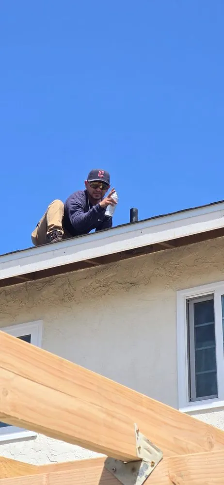 Slide of J&E Roofing Services