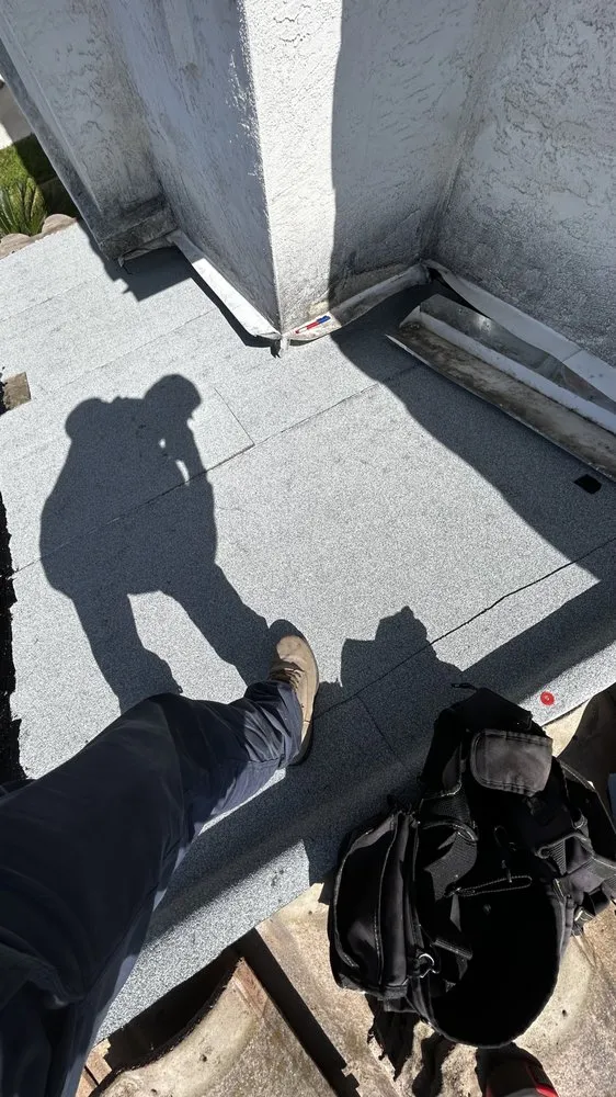 Slide of J&E Roofing Services