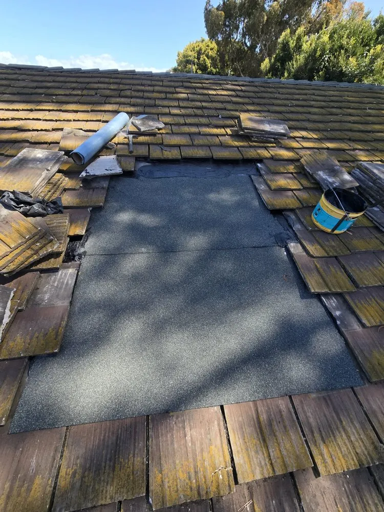 Slide of J&E Roofing Services