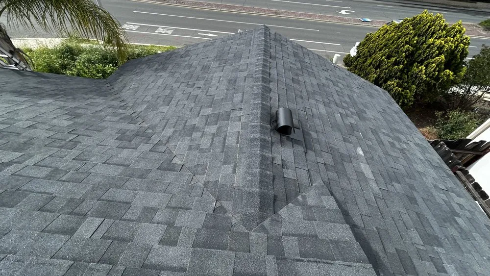 Slide of J&E Roofing Services