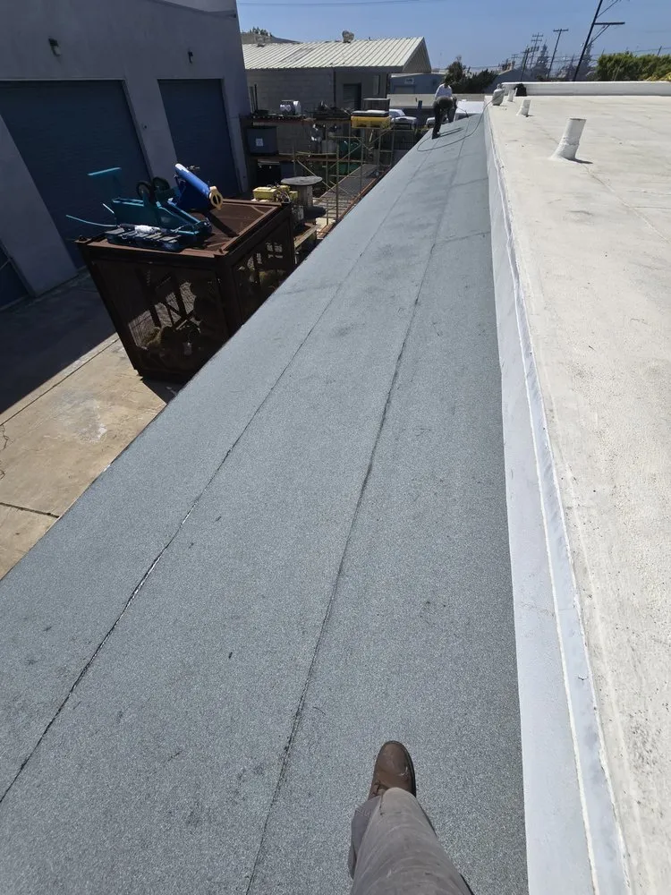 Slide of J&E Roofing Services