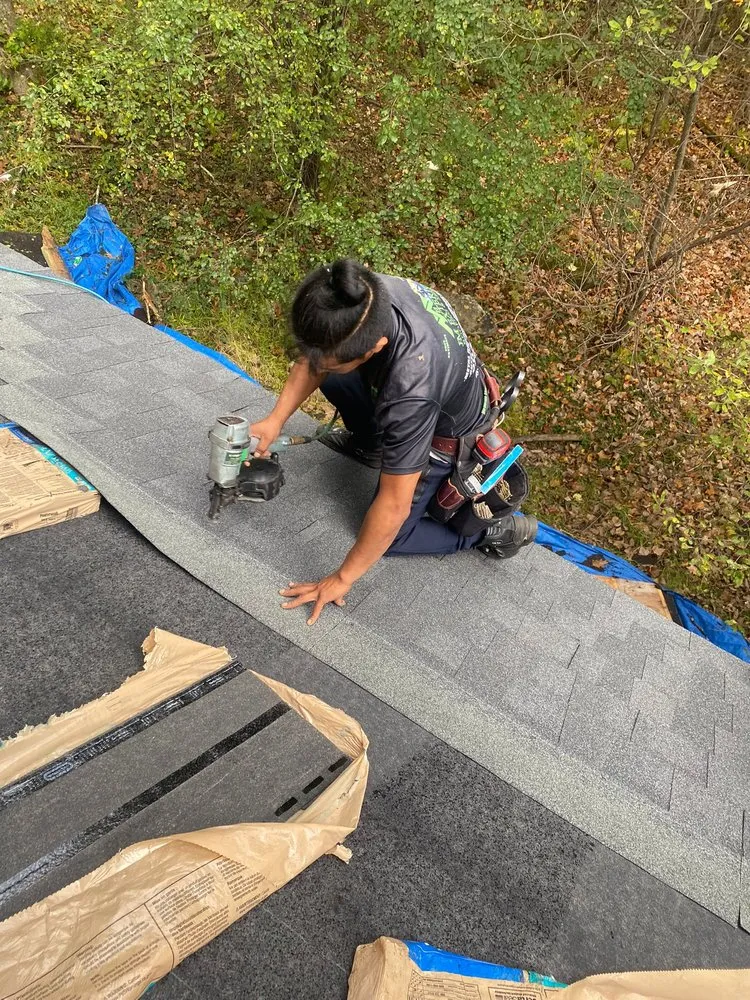 Slide of JM Exteriors Roofing Siding