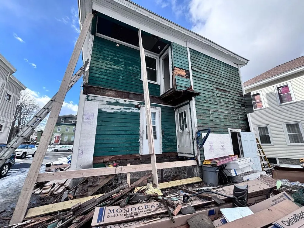 Slide of JM Exteriors Roofing Siding