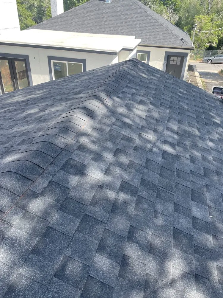 Slide of JM Roofing Solutions