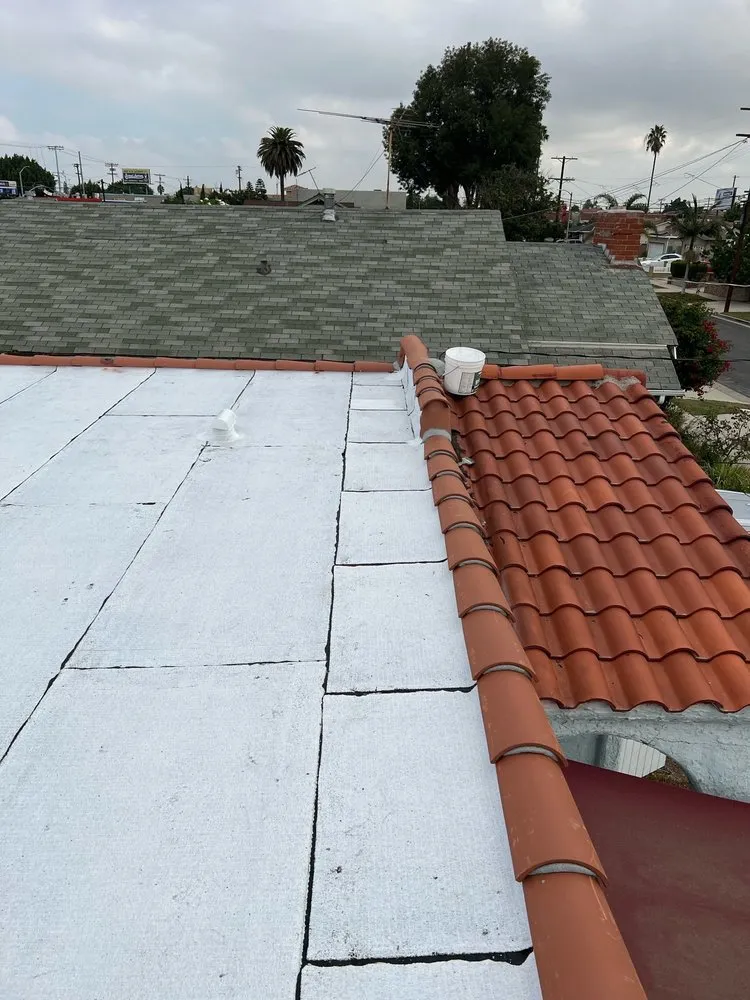 Licensed storm damage roof repair in Wilmington, CA by JMT Roofing
