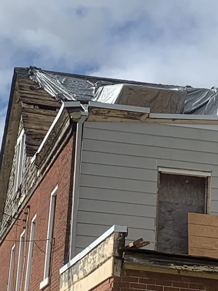 Slide of John Connor Roofing