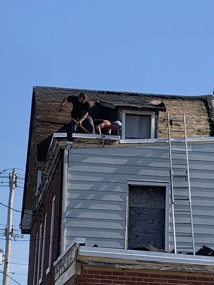 Slide of John Connor Roofing