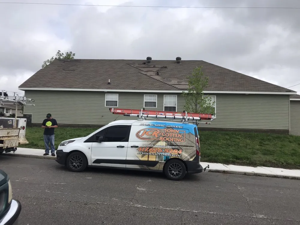Slide of John Cotten Roofing