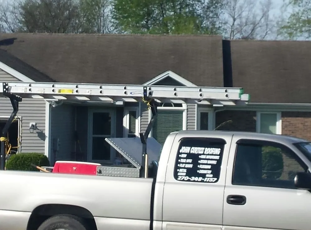 Slide of John Curtiss Roofing