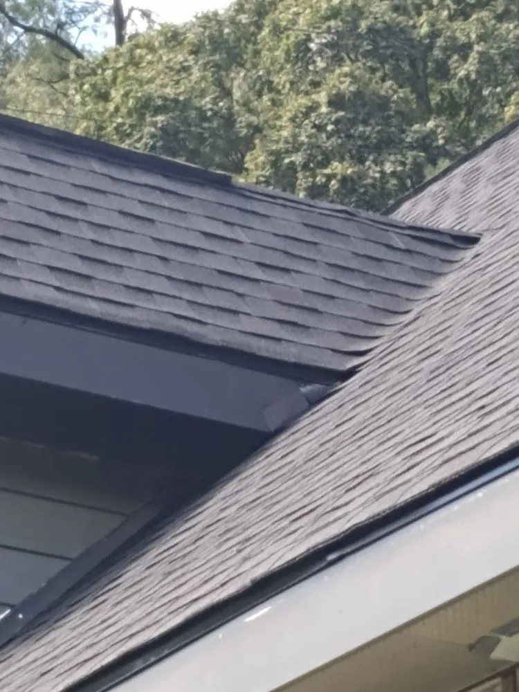 Slide of John Henry Roofing