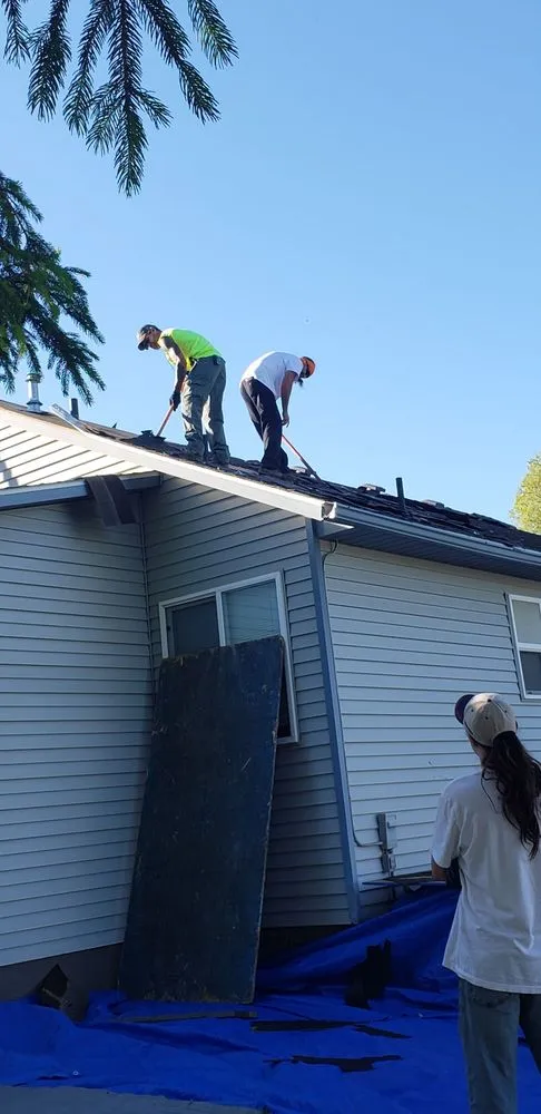Slide of John Holcomb roofing