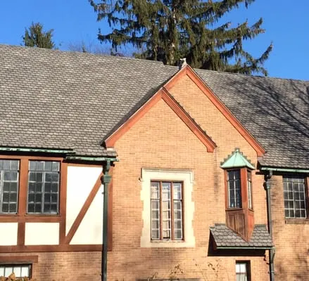 John M Shinn Roofing Logo