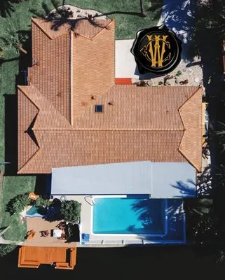 Johnny T. Wiedmann Roofing Logo