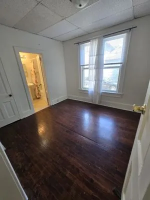 John's Tree Roofing and Construction Logo