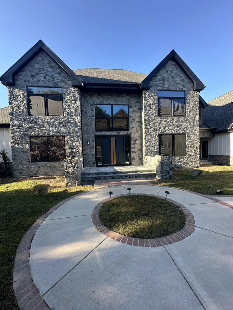 Slide of Jonny and Brothers Roofing