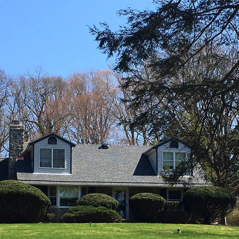 Professional roof inspection after storm damage in Newtown Square, PA by Just Improvements Roofing & Siding
