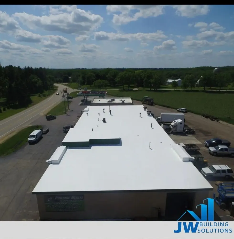 Local flat roof repair in Barnett, MO by JW Building Solutions