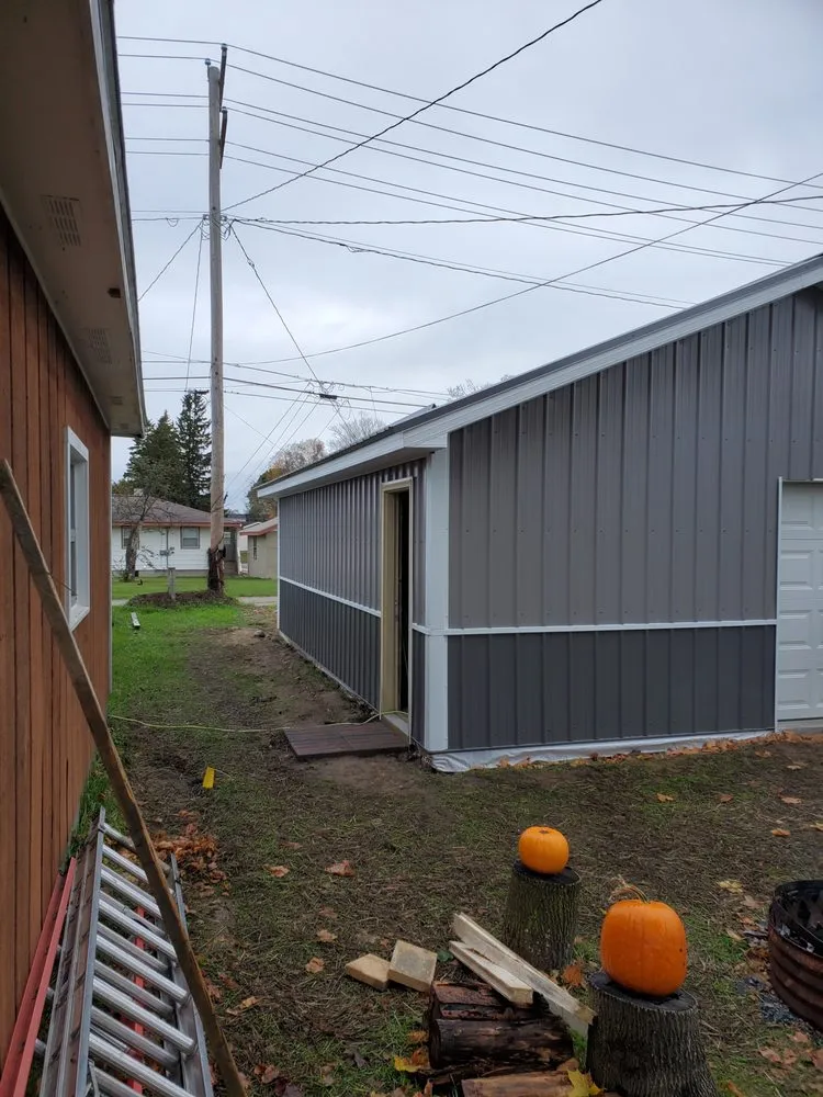 Emergency roof leak repair for homes in Snover, MI by K & M Home Improvements