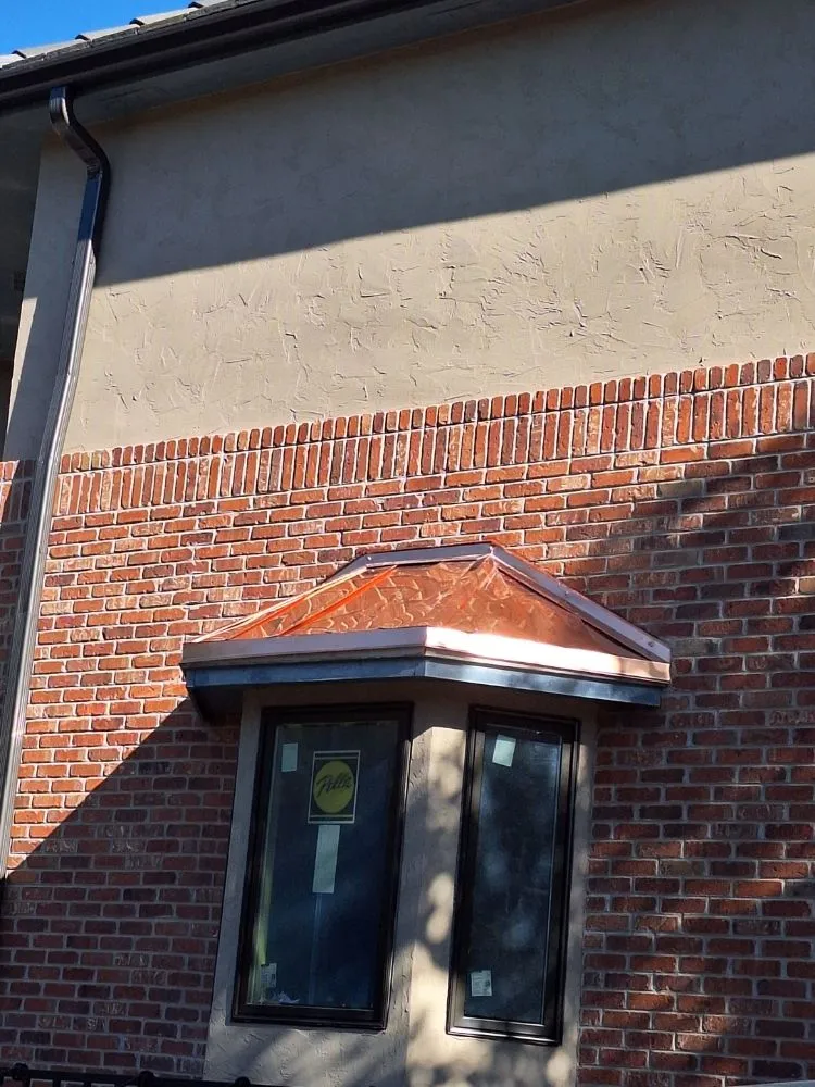 Slide of K & M Roof and Metal Works