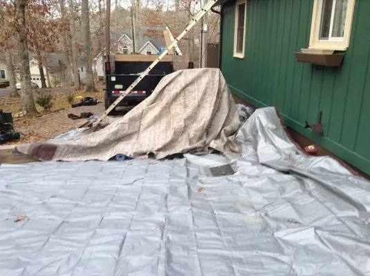 K & M Roofing Company Logo