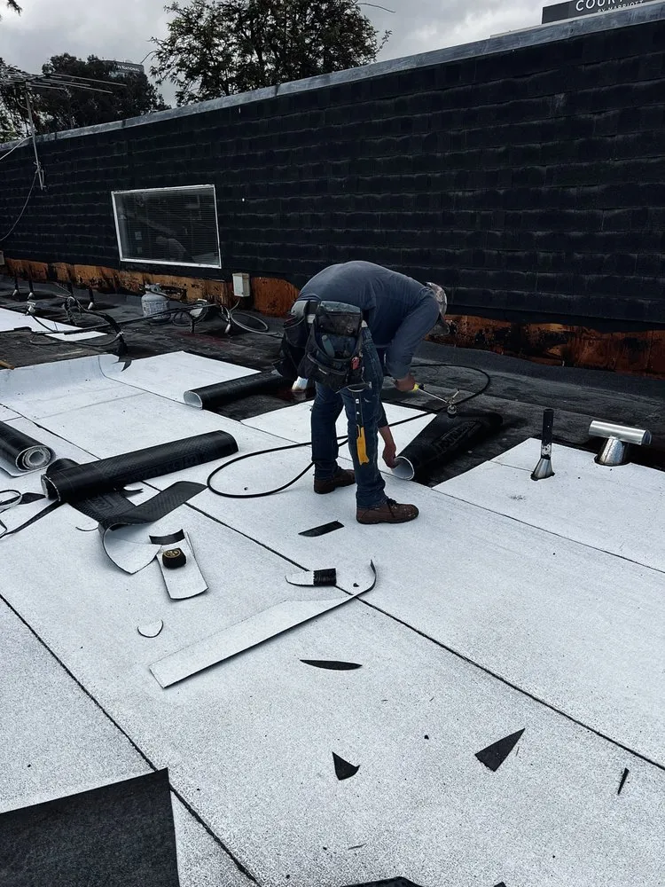 Slide of Kayhan's Roofing