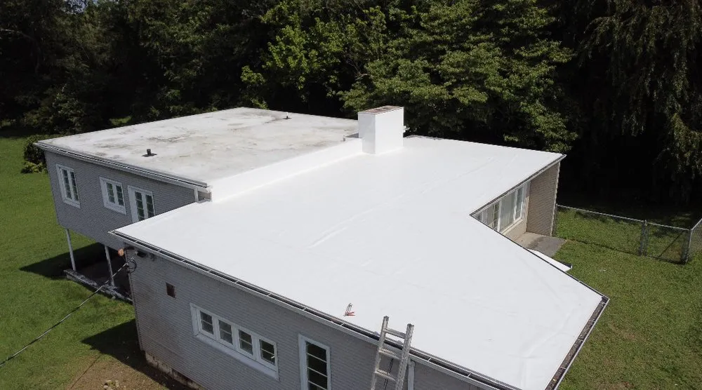 Slide of Kelt Roofing Company