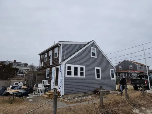 Kenny Nukes Roofing and Construction Logo